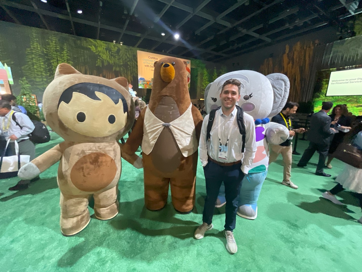 Jacob poses with Salesforce mascots